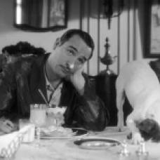 Jean Dujardin is upstaged by Uggie in a scene from The Artist